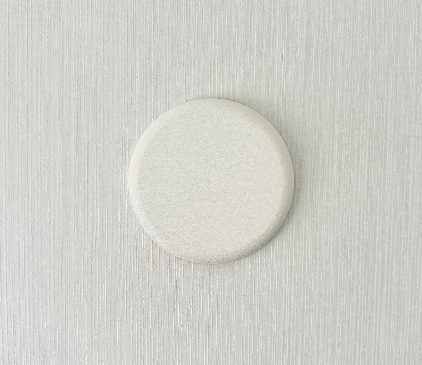 White ceiling rose on a textured background