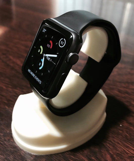 Watch display stand holding an apple watch